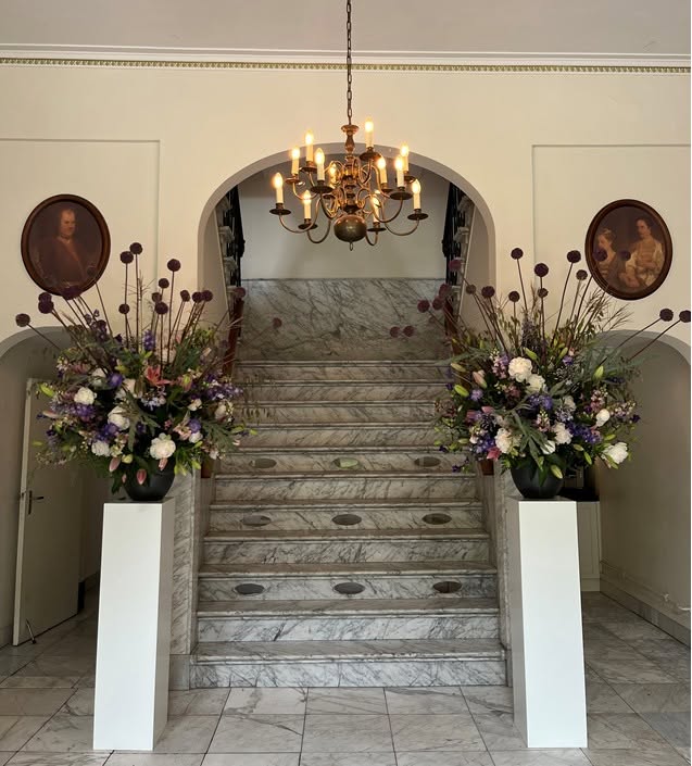 The flower-lined marble staircase